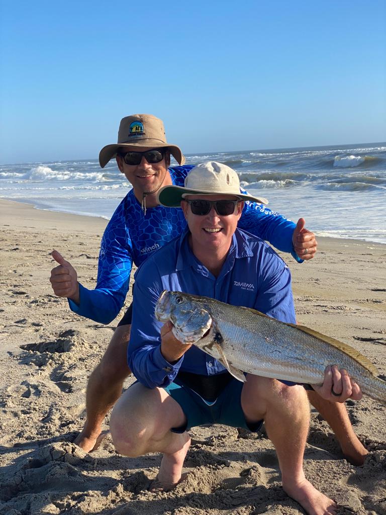 dewald and client posing with a big kob